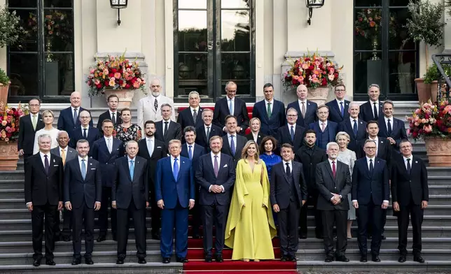 US President Donald Trump, center left, along with the King Willem-Alexander and Queen Maxima of the Netherlands, center, poses for a family photo at the 2025 NATO summit in The Hague, on Tuesday, June 24, 2025. (Haiyun Jiang/Pool Photo via AP)