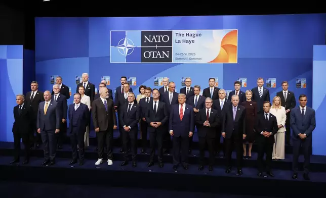 NATO heads of state and government pose for a group photo during the NATO summit in The Hague, Netherlands, Wednesday, June 25, 2025. (AP Photo/Geert Vanden Wijngaert)