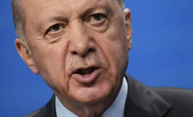 Turkish President Recep Tayyip Erdogan speaks during a media conference at the NATO summit in The Hague, Netherlands, Wednesday, June 25, 2025. (AP Photo/Matthias Schrader)