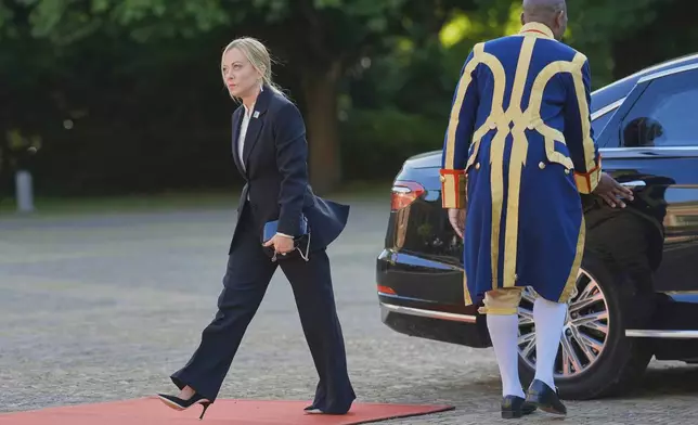 Italy's Prime Minister Giorgia Meloni arrives for a formal dinner at the Paleis Huis ten Bosch ahead of the NATO summit in The Hague, Netherlands, Tuesday, June 24, 2025. (AP Photo/Markus Schreiber)