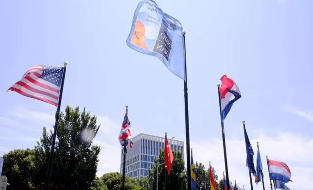 International flags on the venue ahead of the upcoming NATO summit in The Hague, Netherlands, Monday, June 23, 2025. (AP Photo/Patrick Post)