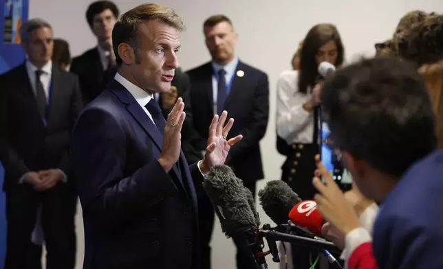 French President Emmanuel Macron speaks during a media conference at the NATO summit in The Hague, Netherlands, Wednesday, June 25, 2025. (AP Photo/Geert Vanden Wijngaert)