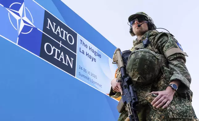 Security patrol around the perimeter of the venue in The Hague, Netherlands, Monday, June 23, 2025 ahead of the upcoming NATO summit. (AP Photo/Geert Vanden Wijngaert)
