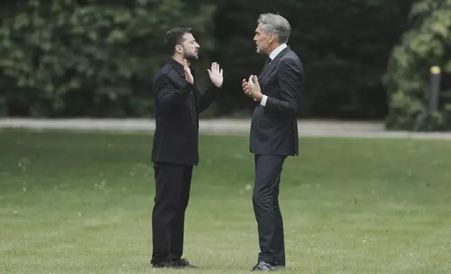 Netherland's Prime Minister Dick Schoof, right, speaks with Ukraine's President Volodymyr Zelenskyy during a meeting at the Catshuis on the sidelines of the NATO summit in The Hague, Netherlands, Tuesday, June 24, 2025. (AP Photo/Markus Schreiber)
