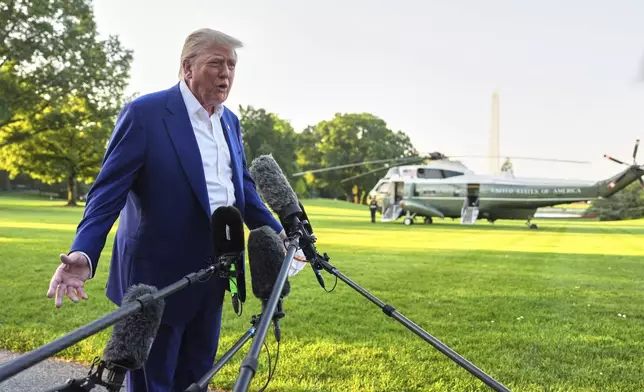 President Donald Trump speaks with reporters before boarding Marine One on the South Lawn of the White House, Tuesday, June 24, 2025, on his way to The Hague, to join world leaders gathering in the Netherlands for a two-day NATO summit. The Washington Monument stands right. (AP Photo/Evan Vucci)
