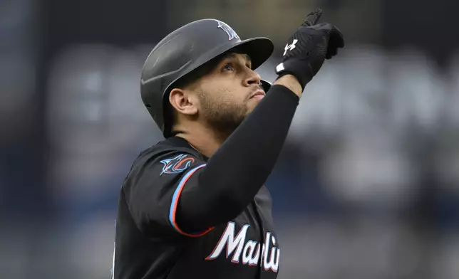 Miami Marlins' Agustin Ramirez celebrates his home run as he rounds the bases during the first inning of a baseball game against the Washington Nationals, Friday, June 13, 2025, in Washington. (AP Photo/Nick Wass)