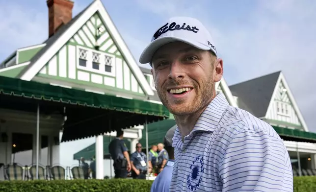 Matt Vogt walks past the clubhouse to the first tee for a practice round for the 2025 US Open golf championship at Oakmont Country Club in Oakmont, Pa. Monday, June 9, 2025. (AP Photo/Gene J. Puskar)