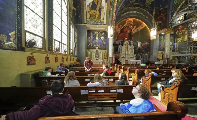 Crafton Elementary School sixth-graders study the murals of Maxo Vanka in St. Nicholas Croatian Catholic Church in Millvale, Pa., on Tuesday, March 18, 2025. (AP Photo/Gene J. Puskar)