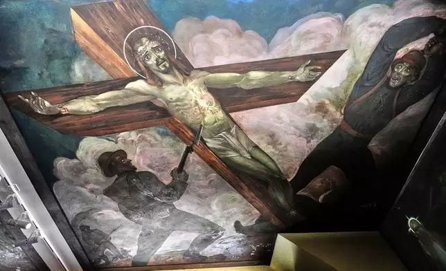 A mural by Croatian-American artist Maxo Vanka titled "Christ on the Battlefield" is seen inside St. Nicholas Croatian Catholic Church in Millvale, Pa., Tuesday, March 18, 2025. (AP Photo/Gene J. Puskar)