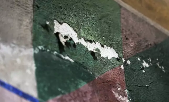 A damaged portion of a mural by Maxo Vanka is seen in St. Nicholas Croatian Catholic Church in Millvale, Pa., on Thursday, Jan 30, 2025. (AP Photo/Gene J. Puskar)