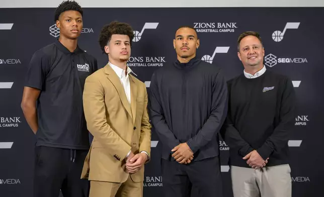Utah Jazz drafted players,left to right, Ace Bailey, Walter Clayton Jr., John Tonje and Austin Ainge, President of Basketball Operations for the Utah Jazz, pose during the Utah Jazz player introduction press conference Sunday, June 29, 2025, in Salt Lake City. (AP Photo/Tyler Tate)