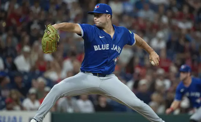 Toronto Blue Jays relief pitcher Mason Fluharty delivers against the Cleveland Guardians during the 10th inning of a baseball game, Wednesday, June 25, 2025, in Cleveland. (AP Photo/Phil Long)