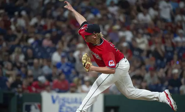 Cleveland Guardians relief pitcher Nic Enright delivers against the Toronto Blue Jays during the 10th inning of a baseball game, Wednesday, June 25, 2025, in Cleveland. (AP Photo/Phil Long)
