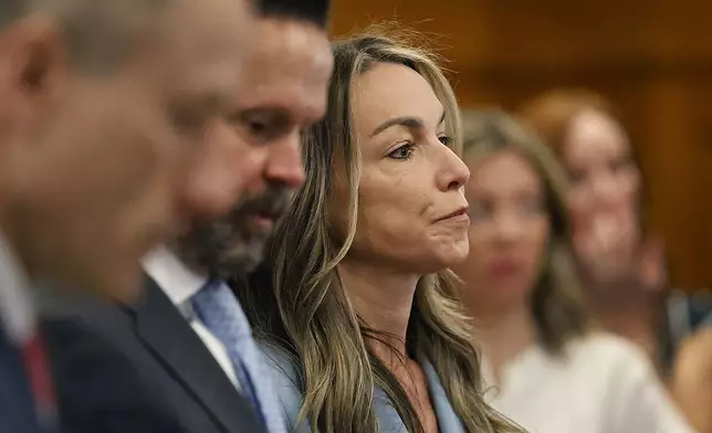 Defendant Karen Read sits with her defense team during her retrial at Norfolk Superior Court in Dedham, Mass., Tuesday June 3, 2025. (Greg Derr/The Patriot Ledger via AP, Pool)