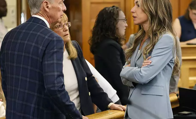 Kare Read, right talks with her parents William and Janet Read during a break in the court proceedings at Norfolk Superior Court in Dedham, Mass., Tuesday June 3, 2025. (Greg Derr/The Patriot Ledger via AP, Pool)