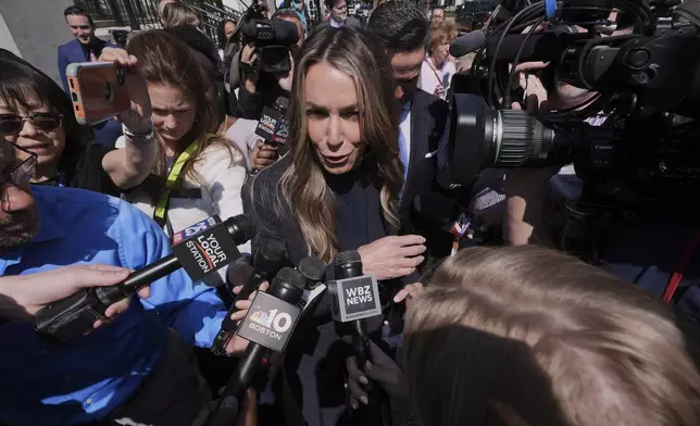 Karen Read is surrounded by media while departing with her attorney Alan Jackson as the jury deliberates at her trial at Norfolk Superior Court, Monday, June 16, 2025, in Dedham, Mass. (AP Photo/Charles Krupa)