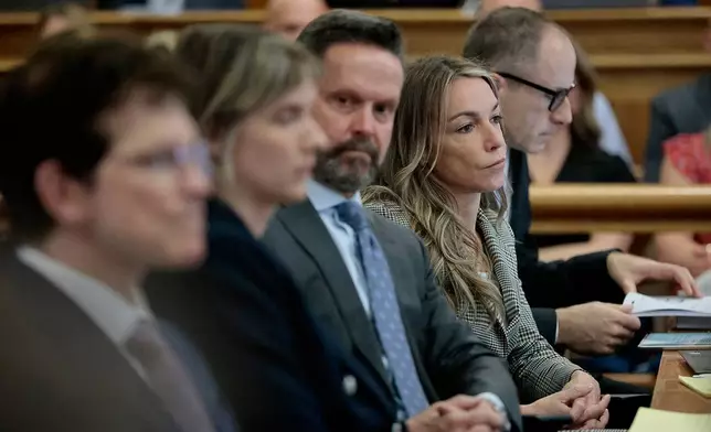 Karen Read sits with her defense team, from left, Robert Alessi, Elizabeth Little, Alan Jackson, and David Yannetti during her murder retrial in Norfolk Superior Court, in Dedham, Mass., Monday June 2, 2025. (Pat Greenhouse/The Boston Globe via AP, Pool)
