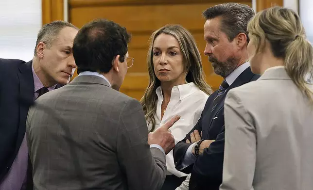 Karen Read talks with her defense team after they rested their case during her retrial in Norfolk Superior Court on Wednesday, June 11, 2025, Dedham, Mass. (Greg Derr/The Patriot Ledger via AP, Pool)