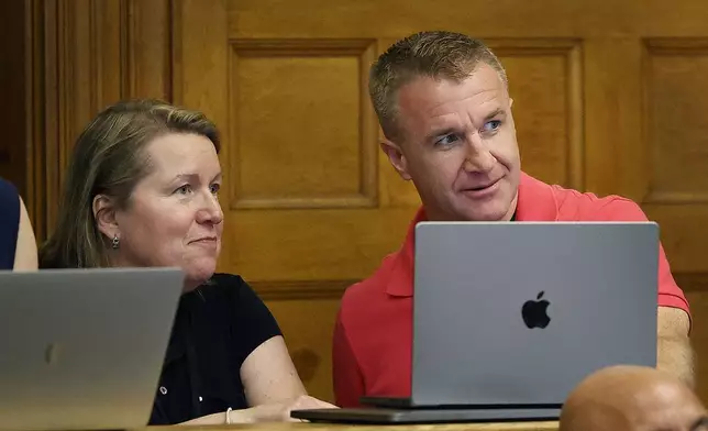 Blogger Aiden Kearney, right, and Canton community cable reporter Andria Galvin talk during a court sidebar while witness snowplow driver Brian Loughran speaks on the stand at Norfolk Superior Court in Dedham, Mass., Tuesday June 3, 2025. (Greg Derr/The Patriot Ledger via AP, Pool)