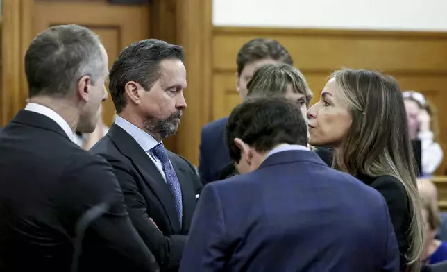 Defendant Karen Read, right, speaks to her defense team, including Alan Jackson, second from left, before closing arguments during her murder trial in Norfolk Superior Court, Friday, June 13, 2025, in Dedham, Mass. (Mark Stockwell/The Sun Chronicle via AP, Pool) /// [EXTERNAL]