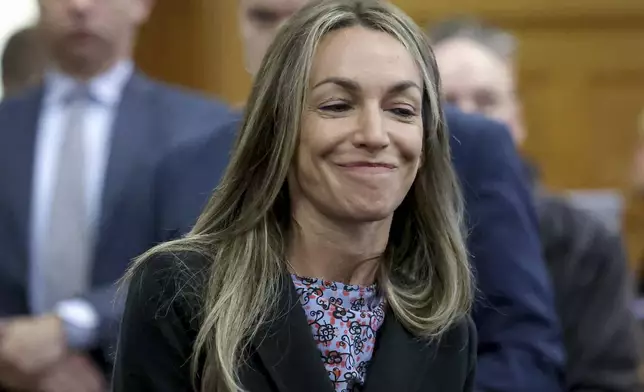 Defendant Karen Read smiles before closing arguments during her murder trial in Norfolk Superior Court, Friday, June 13, 2025, in Dedham, Mass. (Mark Stockwell/The Sun Chronicle via AP, Pool)