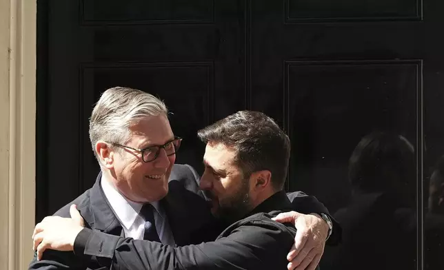 Britain's Prime Minister Keir Starmer welcomes Ukraine's President Volodymyr Zelenskyy to Downing Street in London, Monday, June 23, 2025. (AP Photo/Frank Augstein)