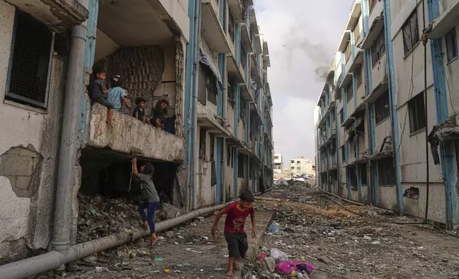 Displaced Palestinians live in a school run by UNRWA, the U.N. agency, in Gaza City, Monday, June 23, 2025. (AP Photo/Jehad Alshrafi)