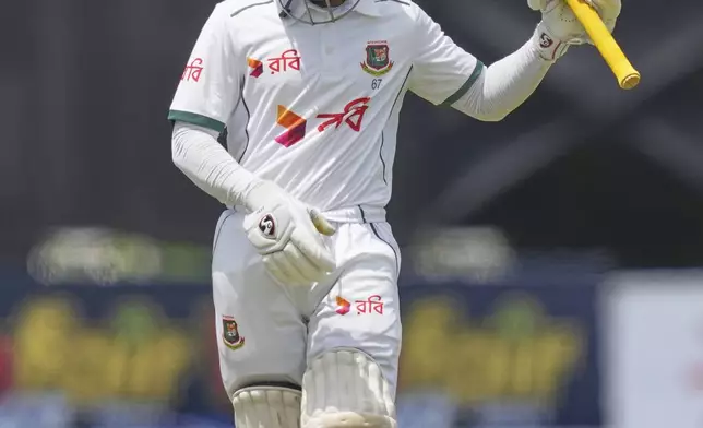 Bangladesh's Mominul Haque leaves the ground after losing his wicket during the first day of the first cricket test match between Sri Lanka and Bangladesh in Galle, Sri Lanka, Tuesday, June 17, 2025. (AP Photo/Eranga Jayawardena)
