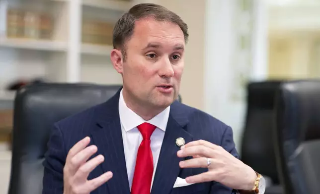 FILE - Virginia Attorney General Jason Miyares speaks during an interview at the Office of the Attorney General in Richmond, Va., May 9, 2023. (AP Photo/Ryan M. Kelly, File)