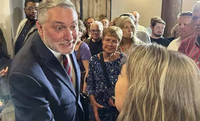 FILE - John Reid, Virginia's Republican nominee for lieutenant governor, greets supporters at his rally at Atlas 42 in Glen Allen, Va., Wednesday, April 30, 2025. (AP Photo/Olivia Diaz,File)