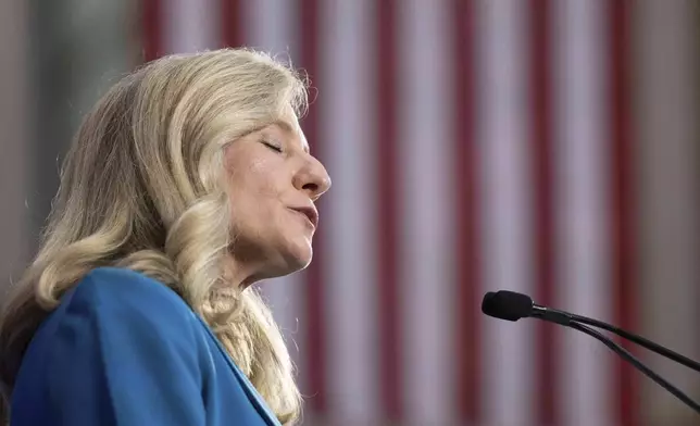 Democratic gubernatorial candidate Abigail Spanberger addresses a crowd at a rally at her alma mater, J.R. Tucker High School, in Henrico, Va., Monday, June 16, 2025. (Mike Kropf /Richmond Times-Dispatch via AP)