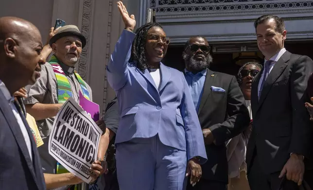 Rep. LaMonica Mclver (D-10th) waves at supporters as she exits a federal court Wednesday, June 25, 2025, in Newark, N.J. (AP Photo/Yuki Iwamura)