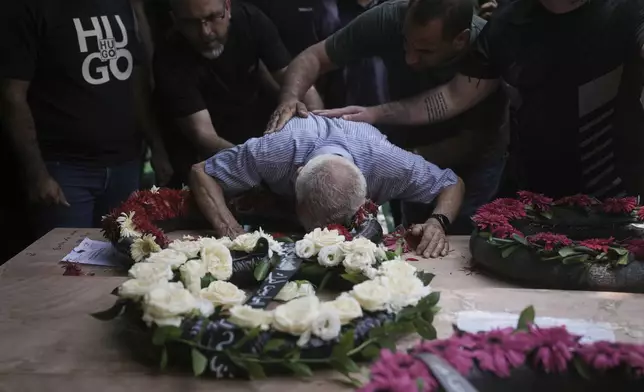 Relatives attend the funeral of four members of the Khatib family, Palestinian citizens of Israel killed in an Iranian missile strike on Tamra, Israel, on Tuesday, June 17, 2025. (AP Photo/Mahmoud Illean)