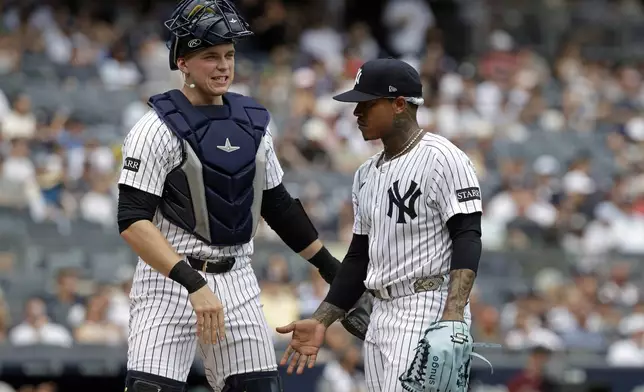 New York Yankees first baseman Ben Rice, left, and Marcus Stroman react walking off during the second inning of a baseball game against the Athletics, Sunday, June 29, 2025, in New York. (AP Photo/Adam Hunger)