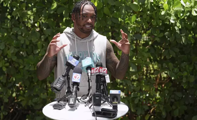 Miami Dolphins quarterback Tua Tagovailoa speaks to the press after a practice at NFL football minicamp, Tuesday, June 10, 2025, in Miami Gardens, Fla. (AP Photo/Rebecca Blackwell)