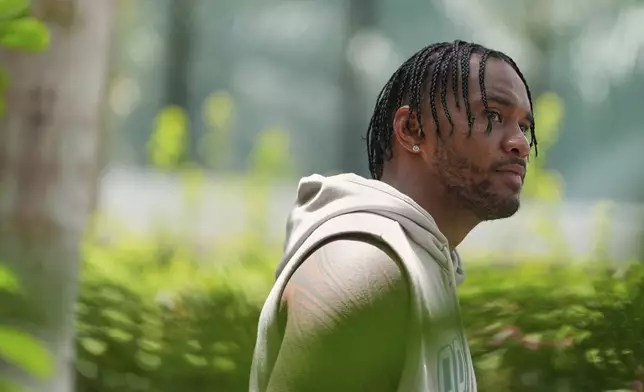 Miami Dolphins quarterback Tua Tagovailoa speaks to the press after a practice at NFL football minicamp, Tuesday, June 10, 2025, in Miami Gardens, Fla. (AP Photo/Rebecca Blackwell)