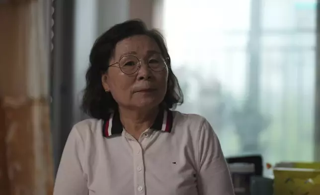 Son Myong Hwa, 63, the North Korea-born daughter of a South Korean POW held in the North, listens to a reporter's question during an interview in Gimpo, South Korea, on June 20, 2025. (AP Photo/Lee Jin-man)