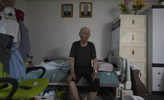 Lee Seon-wu, 94, a former South Korean soldier, lost three fingers and was captured by Chinese troops during a fierce battle in the eastern Gangwon province in the final days of the Korean War, poses for a photo before an interview at his home in Gimpo, South Korea, on June 20, 2025. (AP Photo/Lee Jin-man)