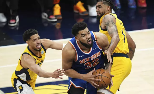 Indiana Pacers forward Obi Toppin (1) defends against New York Knicks center Karl-Anthony Towns (32) during the first half of Game 6 of the Eastern Conference finals of the NBA basketball playoffs in Indianapolis, Saturday, May 31, 2025. (AP Photo/AJ Mast)