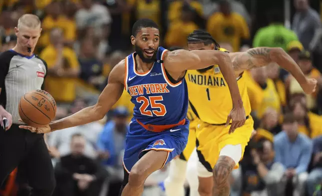 New York Knicks forward Mikal Bridges (25) controls the ball during the second half of Game 6 of the Eastern Conference finals of the NBA basketball playoffs against the Indiana Pacers in Indianapolis, Saturday, May 31, 2025. (AP Photo/Michael Conroy)