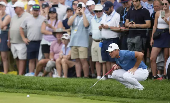 Viktor Hovland, of Norway, lines up a putt on the second hole during the third round of the U.S. Open golf tournament at Oakmont Country Club Saturday, June 14, 2025, in Oakmont, Pa. (AP Photo/Seth Wenig)