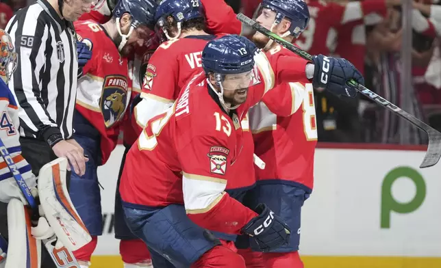 Florida Panthers center Sam Reinhart (13) celebrates his goal during the second period of Game 6 of the NHL hockey Stanley Cup Final against the Edmonton Oilers Tuesday, June 17, 2025, in Sunrise, Fla. (AP Photo/Lynne Sladky)