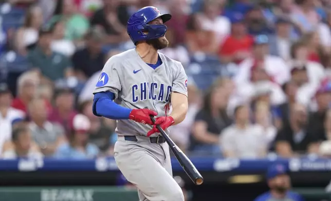 Chicago Cubs' Michael Busch watches after hitting a home run against Philadelphia Phillies pitcher Mick Abel during the fourth inning of a baseball game Tuesday, June 10, 2025, in Philadelphia. (AP Photo/Matt Slocum)