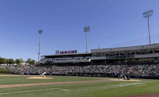Athletics pitcher JP Sears throws to the Cleveland Guardians during the eighth inning of a baseball game Sunday, June 22, 2025, in West Sacramento, Calif. (AP Photo/Sara Nevis)