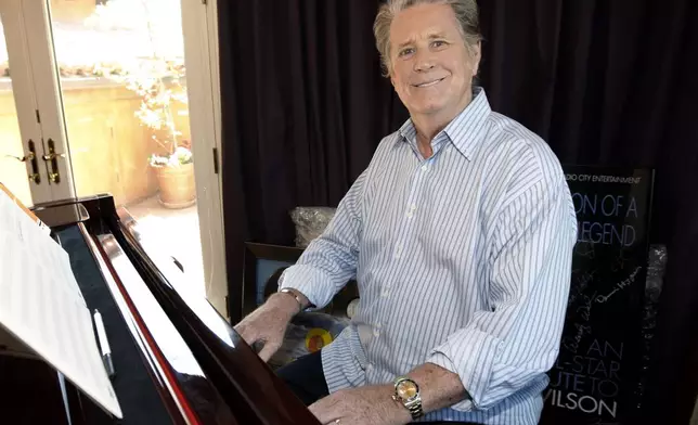 FILE - Musician Brian Wilson poses for a portrait at his home in Los Angeles on July 28, 2008. (AP Photo/Matt Sayles, File)
