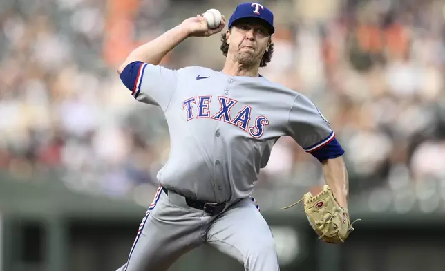 Texas Rangers starting pitcher Jacob deGrom throws during the first inning of a baseball game against the Baltimore Orioles, Wednesday, June 25, 2025, in Baltimore. (AP Photo/Nick Wass)