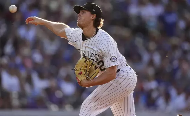 Colorado Rockies starting pitcher Chase Dollander works against the Los Angeles Dodgers in the first inning of a baseball game Wednesday, June 25, 2025, in Denver. (AP Photo/David Zalubowski)