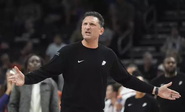 Phoenix Mercury head coach Nate Tibbetts shouts at officials during the second half of a WNBA basketball game against the Golden State Valkyries Thursday, June 5, 2025, in Phoenix. (AP Photo/Ross D. Franklin)