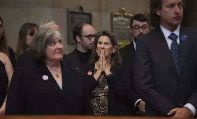 Linda Haluptzok, mother of Melissa Hortman, views the caskets of Melissa and Mark Hortman before funeral services for Mark and Melissa Hortman at the Basilica of St. Mary in Minneapolis, Minn., on Saturday, June 28, 2025. (Alex Kormann/Star Tribune via AP, Pool)