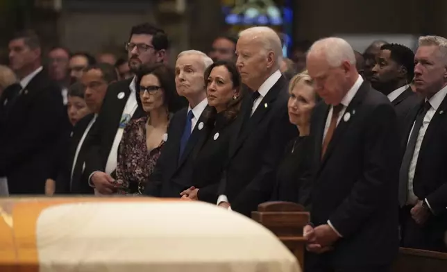 From left, Minnesota attorney general Keith Ellison, Tom Weber, Lt. Gov. Peggy Flanagan, former Minnesota Gov. Mark Dayton, former US Vice President Kamala Harris, former US President Joe Biden, Gwen Walz and Minnesota Gov. Tim Walz attend funeral services for Mark and Melissa Hortman at the Basilica of St. Mary in Minneapolis, Minn., on Saturday, June 28, 2025. (Alex Kormann/Star Tribune via AP, Pool)